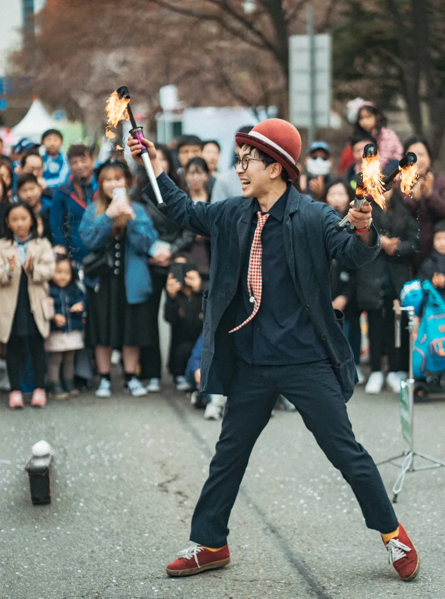 street performer juggling fire