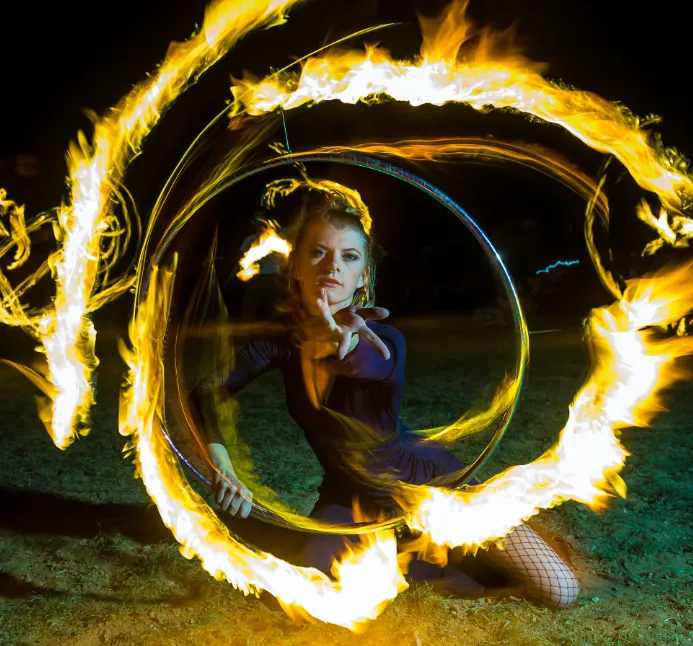 Female Juggler surrounded by flames